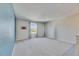 Versatile bonus room with neutral walls, carpet flooring, and a window providing natural light at 11828 Miracle Mile Dr, Riverview, FL 33578