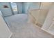 Bright bonus room with carpet flooring and natural light streaming through the windows at 11828 Miracle Mile Dr, Riverview, FL 33578