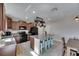 Bright kitchen with island seating, granite countertops, stainless appliances, and tile flooring at 11828 Miracle Mile Dr, Riverview, FL 33578