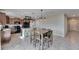 Open floor plan with an island kitchen, granite countertops, and stainless steel appliances at 11828 Miracle Mile Dr, Riverview, FL 33578