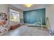 A playroom features tile floors and a large window at 11828 Miracle Mile Dr, Riverview, FL 33578