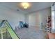 Open playroom features a large doorway to another room and tile floors at 11828 Miracle Mile Dr, Riverview, FL 33578