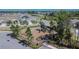 Community playground featuring modern play equipment, surrounded by lush greenery and a secure fence at 11828 Miracle Mile Dr, Riverview, FL 33578