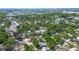 A scenic aerial perspective showcases a quiet, verdant neighborhood filled with mature shade trees and a traditional grid layout at 15204 Westminister Ave, Clearwater, FL 33760