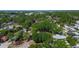 Drone view of a house in a tree filled neighborhood at 15204 Westminister Ave, Clearwater, FL 33760