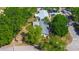 Aerial shot displays the property's roof and landscaping, highlighting its position within a residential neighborhood at 15204 Westminister Ave, Clearwater, FL 33760