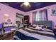 Bedroom featuring stars painted on ceiling, window, bed, desk, and closet at 15204 Westminister Ave, Clearwater, FL 33760