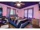 Bedroom features stars painted on ceiling, window, and bed at 15204 Westminister Ave, Clearwater, FL 33760