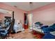Bedroom with hardwood floors, closet, and a dresser at 15204 Westminister Ave, Clearwater, FL 33760