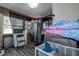 Laundry room featuring stainless steel appliances and natural light at 15204 Westminister Ave, Clearwater, FL 33760