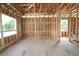 Spacious bedroom with wooden frames for walls and windows, providing a glimpse of the outside at 1627 48Th N Ave, St Petersburg, FL 33714