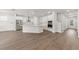 Spacious open kitchen with stainless steel appliances, a large island, and natural wood flooring at 1627 48Th N Ave, St Petersburg, FL 33714