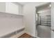 Mudroom featuring built-in shelving with bench and access to the garage at 1627 48Th N Ave, St Petersburg, FL 33714