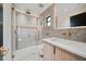 Modern bathroom featuring a glass shower, sleek vanity, and stylish fixtures at 1981 Briarwood St, Dunedin, FL 34698