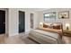 Comfortable bedroom showcasing an ensuite bathroom and large window allowing natural light at 1981 Briarwood St, Dunedin, FL 34698