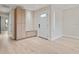 Bright entryway featuring a storage bench and modern door with decorative window at 1981 Briarwood St, Dunedin, FL 34698