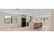 Modern kitchen with a large island, sleek black appliances, and plenty of cabinet space at 1981 Briarwood St, Dunedin, FL 34698