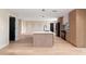 Bright, open kitchen featuring an island with a sink, modern appliances, and wood floors at 1981 Briarwood St, Dunedin, FL 34698
