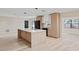 Modern kitchen with a large island, stainless steel appliances, and stylish cabinets at 1981 Briarwood St, Dunedin, FL 34698