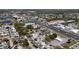 Wide aerial shot of a residential area showing the streets and surrounding neighborhood with nearby commercial establishments at 2122 Holiday Dr, Holiday, FL 34691