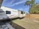 Wide view of RV parking in the backyard, offering convenient space for recreational vehicle storage at 2122 Holiday Dr, Holiday, FL 34691