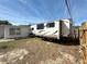 Backyard features RV parking with a gate for easy access and secure storage at 2122 Holiday Dr, Holiday, FL 34691