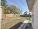 Fenced backyard with a fresh wooden fence, offering privacy and space for outdoor activities at 2122 Holiday Dr, Holiday, FL 34691