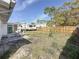 Backyard featuring patio set and RV parking, ready for outdoor enjoyment and accommodating travel needs at 2122 Holiday Dr, Holiday, FL 34691