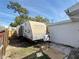 RV parking in the backyard, providing a practical solution for recreational vehicle storage at 2122 Holiday Dr, Holiday, FL 34691