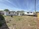 Backyard showcasing RV parking, a patio area, and ample space for outdoor activities at 2122 Holiday Dr, Holiday, FL 34691