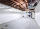 Spacious unfinished basement with exposed ceiling beams, offering ample storage or renovation potential at 2122 Holiday Dr, Holiday, FL 34691