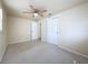 Comfortable bedroom with a ceiling fan and closet with white panel doors at 2122 Holiday Dr, Holiday, FL 34691