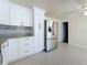 Beautiful kitchen showcasing updated stainless steel appliances and granite countertops at 2122 Holiday Dr, Holiday, FL 34691