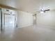 Spacious living room with retro flooring, ceiling fans and lots of natural light at 2122 Holiday Dr, Holiday, FL 34691