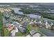 Aerial view of the community showcasing the home's location near lakes and other homes at 2218 132Nd E Pl, Parrish, FL 34219