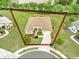 Aerial view of a charming single-story home with well-maintained landscaping and a spacious front yard at 2218 132Nd E Pl, Parrish, FL 34219
