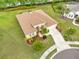 Aerial view of a well-manicured property featuring lush landscaping, a spacious driveway, and a manicured lawn at 2218 132Nd E Pl, Parrish, FL 34219