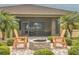 Backyard patio with a brick firepit and outdoor seating, perfect for entertaining at 2218 132Nd E Pl, Parrish, FL 34219