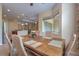 Dining area featuring seating for six and seamless access to the kitchen and an additional living space at 2218 132Nd E Pl, Parrish, FL 34219