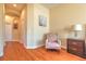 Inviting hallway with wood floors, arched entryway, and chair rail adding a touch of elegance at 2218 132Nd E Pl, Parrish, FL 34219