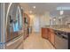 Well-equipped kitchen with granite countertops, stainless steel appliances, and tile flooring at 2218 132Nd E Pl, Parrish, FL 34219
