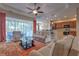 Spacious living room with comfortable seating, natural light, and an open layout to the kitchen at 2218 132Nd E Pl, Parrish, FL 34219
