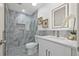 An elegantly designed bathroom with updated tiling, a glass shower, and modern fixtures. Lots of natural light at 2328 Dartmouth N Ave, St Petersburg, FL 33713