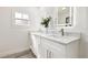 Updated bathroom with a double vanity, quartz countertop, dual sinks, and modern fixtures at 2328 Dartmouth N Ave, St Petersburg, FL 33713