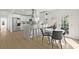 Modern kitchen with stainless steel appliances, island seating, and adjoining dining area at 2328 Dartmouth N Ave, St Petersburg, FL 33713