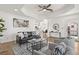 Open-concept living room with modern furnishings and views into the kitchen area at 2328 Dartmouth N Ave, St Petersburg, FL 33713
