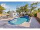 Inviting backyard featuring a sparkling pool, brick patio, lush landscaping, and a pool house at 2328 Dartmouth N Ave, St Petersburg, FL 33713