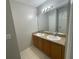 Bathroom featuring a double sink vanity and tile flooring at 2520 Edgewater Falls Dr, Brandon, FL 33511