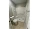 Bathroom featuring a shower and bathtub combo with white tiling at 2520 Edgewater Falls Dr, Brandon, FL 33511