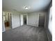 Spacious main bedroom with plush carpet, a large closet, and an ensuite bathroom at 2520 Edgewater Falls Dr, Brandon, FL 33511